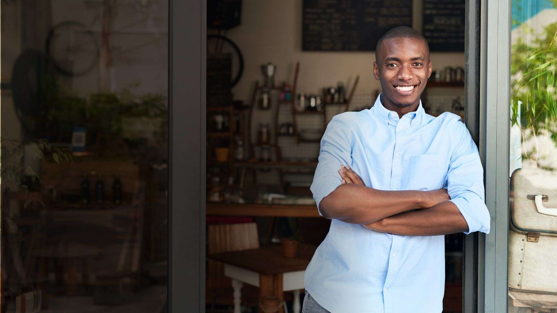 Retail business owner infront of store Deposita